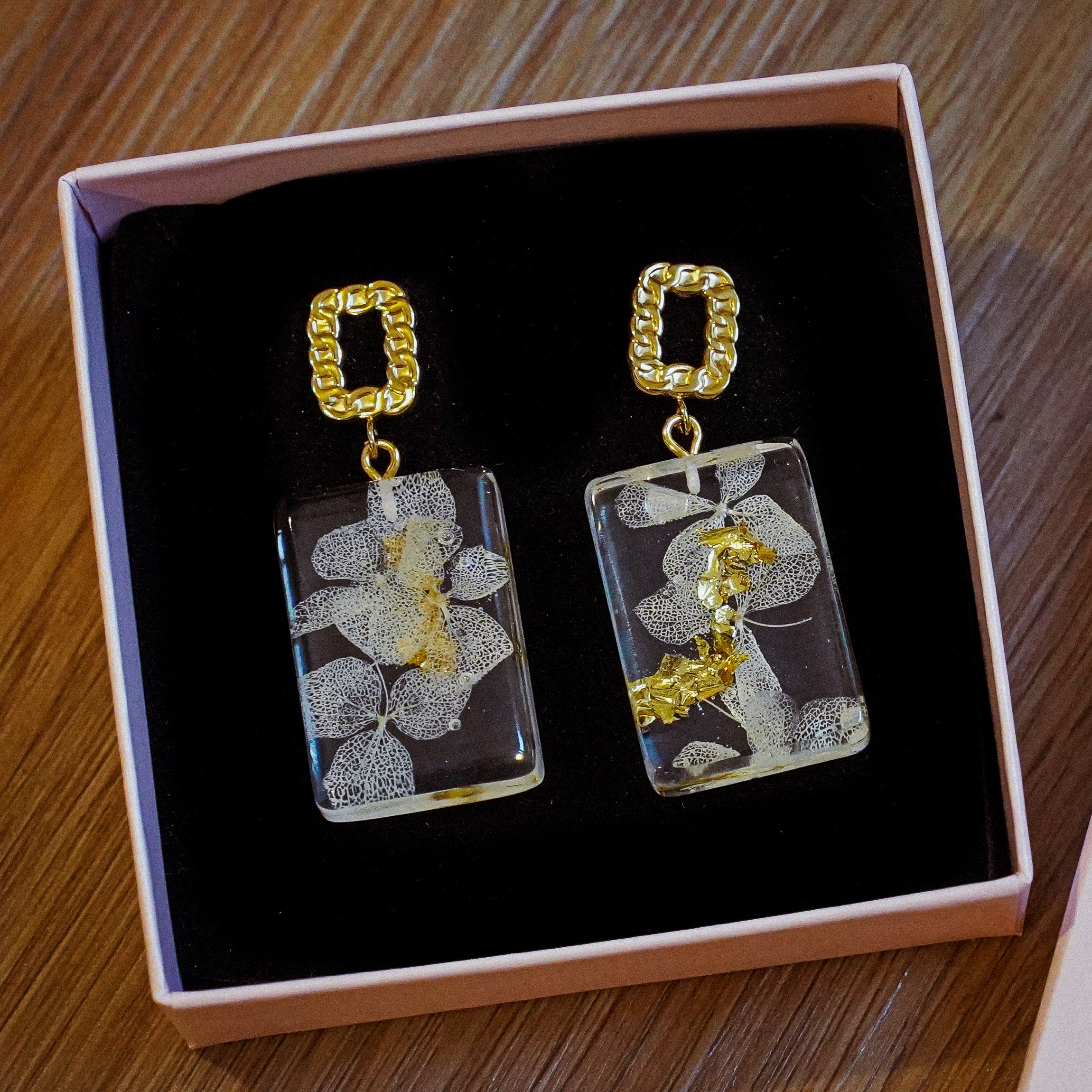 White Hydrangea Alma Earrings with gold leaves in Golden Stainless Steel